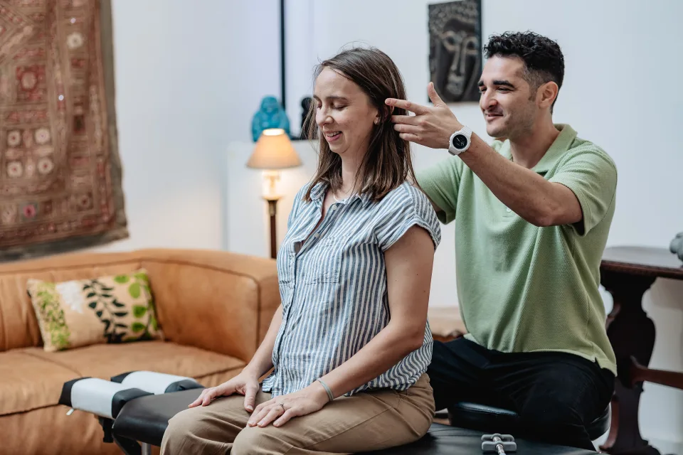 Dr. Daniel Goodman performing gentle Upper Cervical examination for vertigo patient in Lower Manhattan clinic
